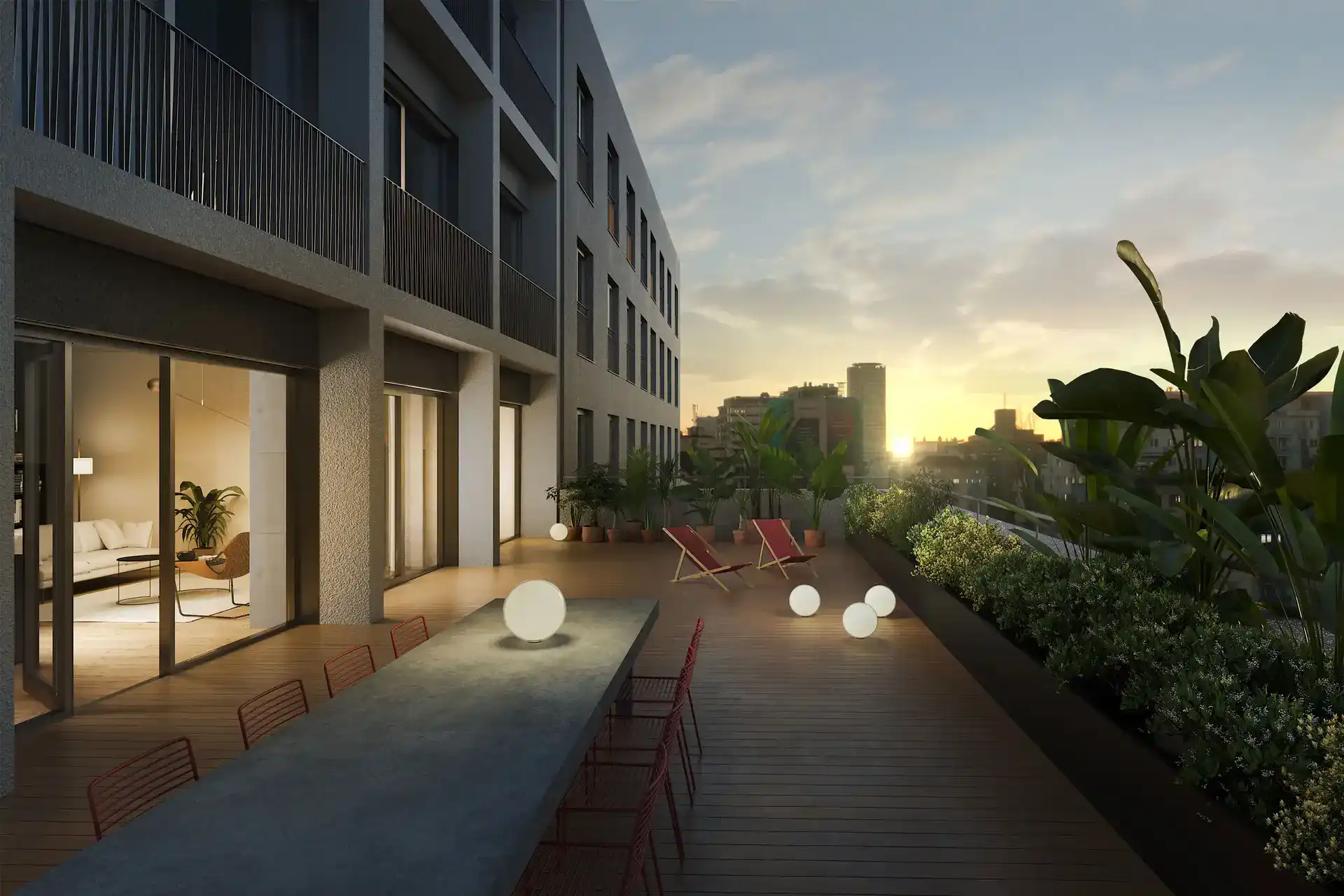 Strešná terasa projektu Lofty Kominárska ponúka výhľad na centrum Bratislavy a priestor pre komunitné posedenie v industriálnom štýle